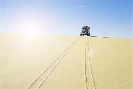 Car in hot desertの写真素材