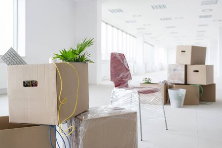 Cardboard boxes in new empty officeの写真素材