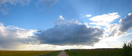 Landscape with Scenic Sky with Beautiful Clouds. Panorama  with Road and Horizon.の写真素材