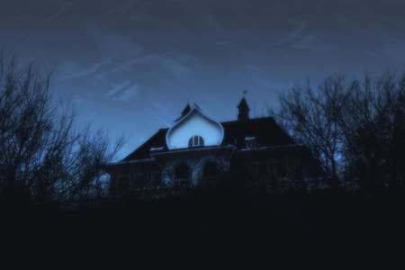 Spooky House in Night Forest. Dusk Winter Landscapeの写真素材