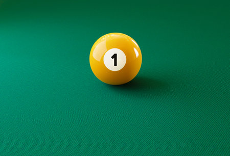 Billiard ball number one isolated on the green tableの写真素材