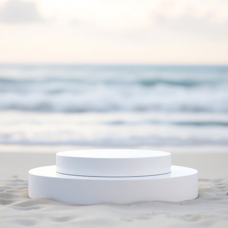 White round podium on the sand with sea background. 3d renderの写真素材