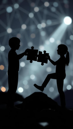 Silhouette of a boy and a girl holding a puzzle piece.の写真素材