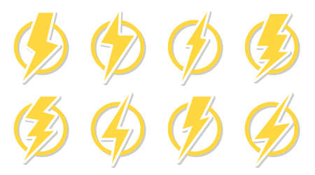 Yellow lightning bolt icon set. Electrical strike sign sticker in circle.のイラスト素材