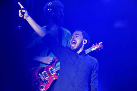 BANGKOK THAILAND SEPTEMBER 23 :Mike Shinoda of Linkin Park perform on Linkin Park Live in Bangkok A Thousand Suns World Tour 2011 at Impact Maungthong Thani, September 23,2011 Bangkok Thailandのeditorial素材