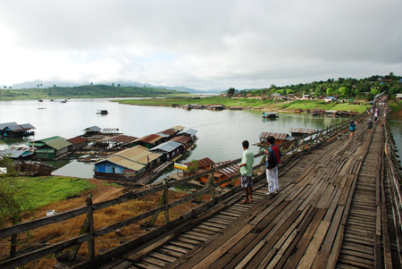 The wooden bridge is the second longest in the world at Sangklaburi in Kanchanaburi, Thailandのeditorial素材