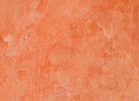 Red cement wall, textured background.の写真素材