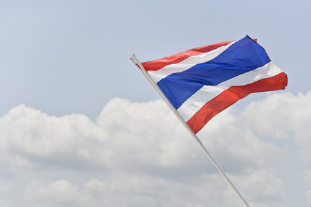 Thailand flag on boat with blue sky.の写真素材