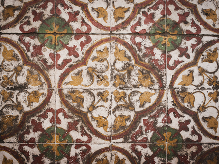 Traditional tiles on facade of old hosue in Thailand.
