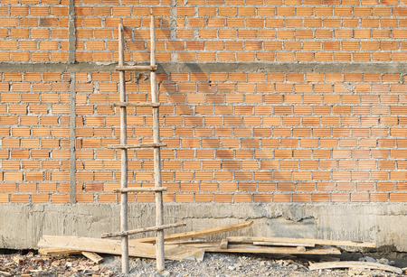 Wooden Ladder near Brick Wall.の写真素材