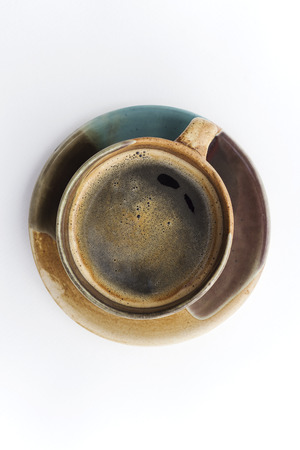 Coffee cup and saucer on a white background.の写真素材