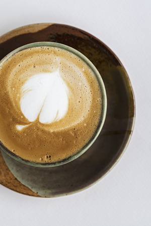 A Cup of Hot Latte Art Coffee on White Background.の写真素材