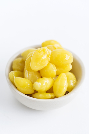 Gingko Nuts in a Bowl on White Background.の写真素材