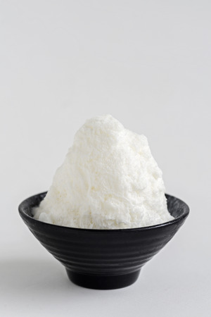 Milk ice shaved on white background. (Selective Focus)の写真素材
