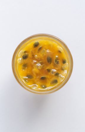 Passion Fruit Juice in a Glass on white background. (Top View)の写真素材