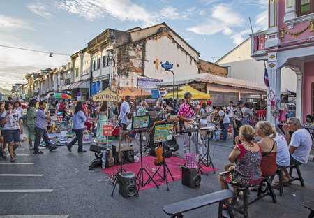 PHUKET, THAILAND NOVEMBER 01, 2015: Tourists shop at the old town night market (walking street) among old building Chino Portuguese style, street of Phuket town in Phuket, Thailand.のeditorial素材