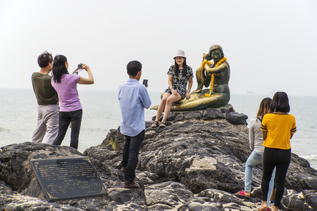 SIMILA BEACH, SONGKLA, THAILAND-Oct 24, 2015: People shooting with Mermaid rock monument at Songkla beach, Thailand.のeditorial素材