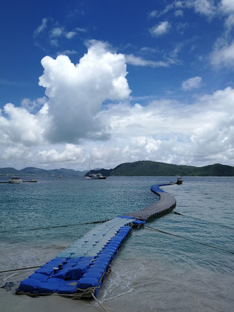 A floating pier for loading and unloading passenger on a shallow water, Phuket, Thailandの写真素材