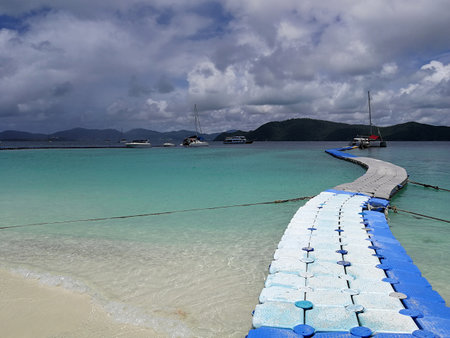 A floating pier for loading and unloading passenger on a shallow water, Phuket, Thailandの写真素材