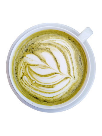 Hot green tea mutcha latte with latte art in ceramic cup on wooden tableの写真素材