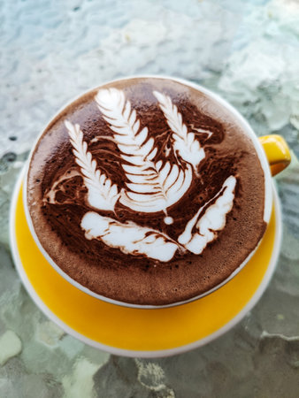 Hot Chocolate drink with latte art, top view.の写真素材