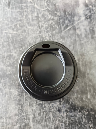 Black plastic coffee cup lid, top viewの写真素材