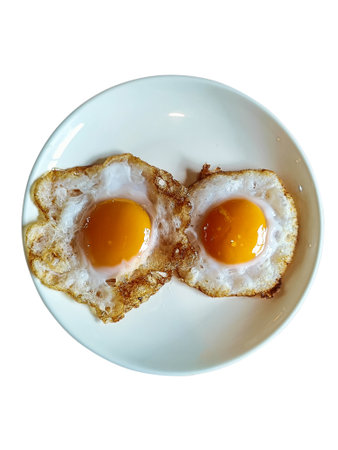 Fried eggs in a plate, food breakfast, healthy proteins.の写真素材