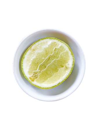 White bowl of lime half slice (Selective Focus)の写真素材