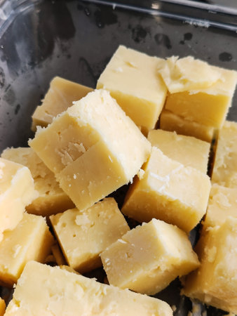 Closeup of vintage cheese cubes in a box. (Selective Focus)の写真素材