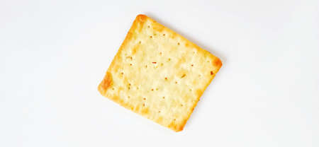 Sugarless and vegetable healthy cracker biscuit slices on the gray white studio background. Food background design. Suitable for promotion of food and beverage industry and companyの写真素材
