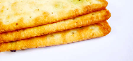 Sugarless and vegetable healthy cracker biscuit slices on the gray white studio background. Food...