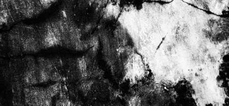 Abstract nature pattern silhouetto of wall with some crack, big dark spot, and brick line contour. Grunge background design. Available for text. Architecture background design.の写真素材