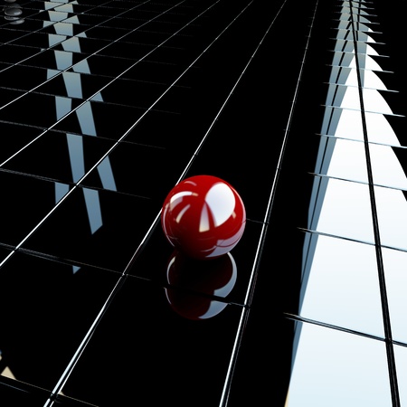 Lonely red sphere over glossy surfaceの写真素材