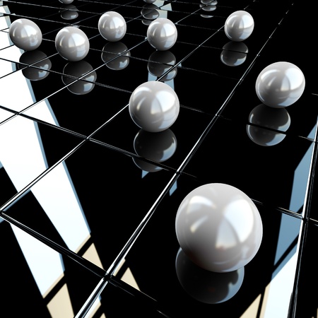 White shperes on black glossy backgroundの写真素材