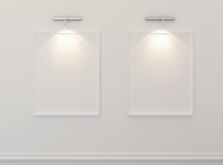 White blank picture frames over white wallの写真素材