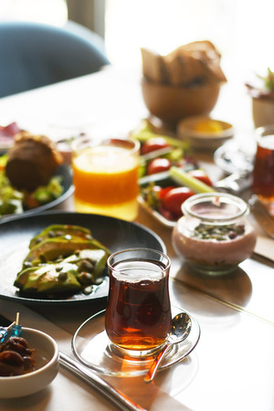 Turkish breakfast with various plates on a tableの写真素材