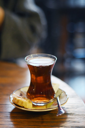 Tea in traditional turkish glass on a tableの写真素材