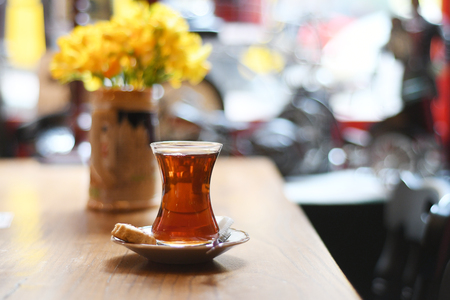 Tea in traditional turkish glass on a tableの写真素材