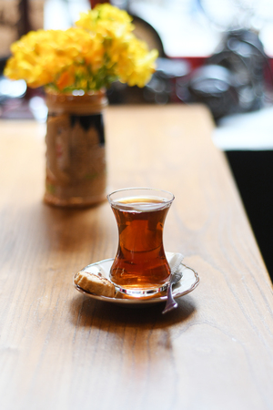 Tea in traditional turkish glass on a tableの写真素材