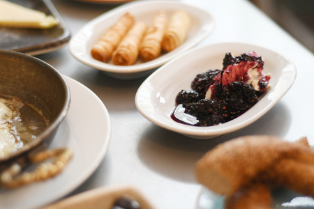 Blackberry jam on a plate with creamの写真素材