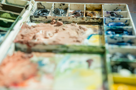 Watercolor paints box palette on wooden floorの写真素材