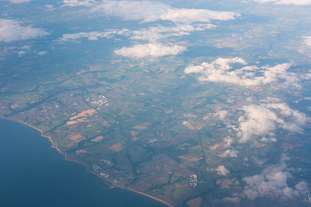 land and sea seen from airplaneの写真素材