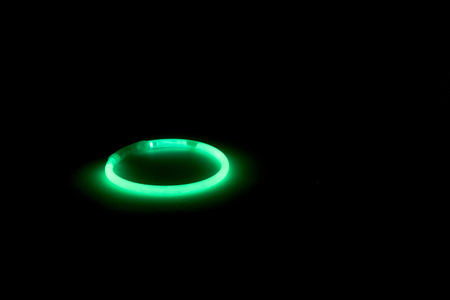 Green Glow Stick in Round Shape, For Party, Celebration. In Black Backgroundの写真素材
