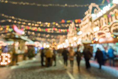 Blurred image bokeh of People walking, shopping at Christmas Market in Moscow, Russia.の写真素材