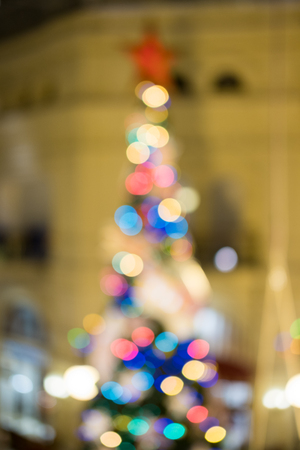 Blurred image bokeh of Christmas tree with lighting and decoration.の写真素材