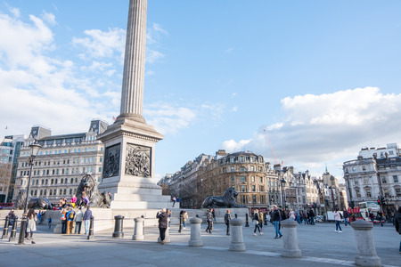 London, England - 24 February 2017 : People walking around Trafalgar Square, the public square in the City of Westminster, Central London, built around the area formerly known as Charing Cross.のeditorial素材