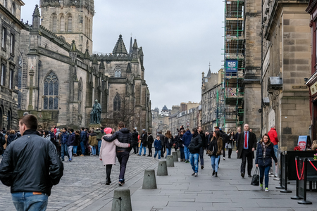 Edinburgh, United Kingdom. 17 February 2017 : People walking on The Royal Mile, a succession of streets forming the main thoroughfare of the Old Town of the city of Edinburgh in Scotlandのeditorial素材