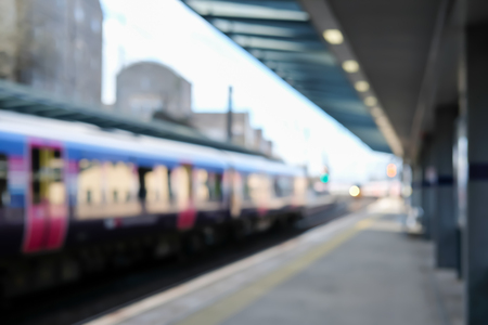 Blurred image bokeh of Train arriving at Heymarket Train Station in Edinburgh, United Kingdom