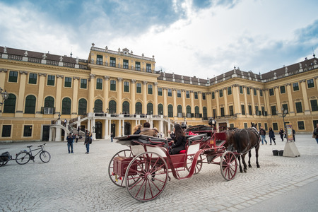 Vienna, Austria - 15 April 2017 : People walking around Schonbrunn Palace in Vienna. the Baroque palace which is a former imperial summer residence in Vienna.のeditorial素材