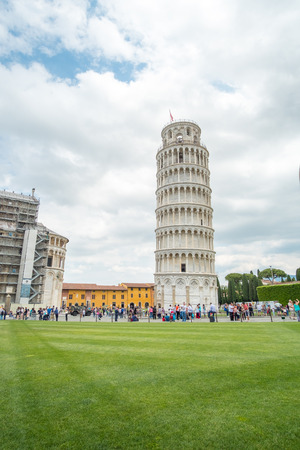 Pisa, Italy - 19 May 2017 : People walking around the Leaning Tower of Pisa, one of the most famous landmark in Italy, with Cattedrale di Pisa or Cathedral.のeditorial素材